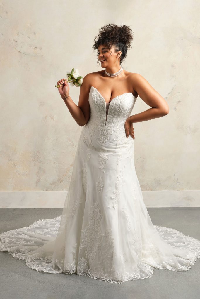 Maggie Sottero Kyler Strapless A-Line Sequin Glitter Tulle Wedding Dress with Pointed Sweetheart Neckline and Beaded Lace Motifs in Denver, Colorado at The Bridal Collection