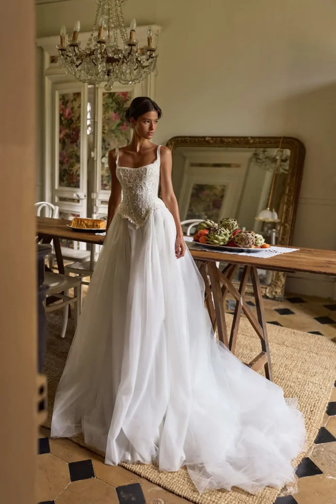 Milla Nova Dawnelle Wedding gown. Peplum, basque waist bodice, lace, beading, tulle a-line skirt.