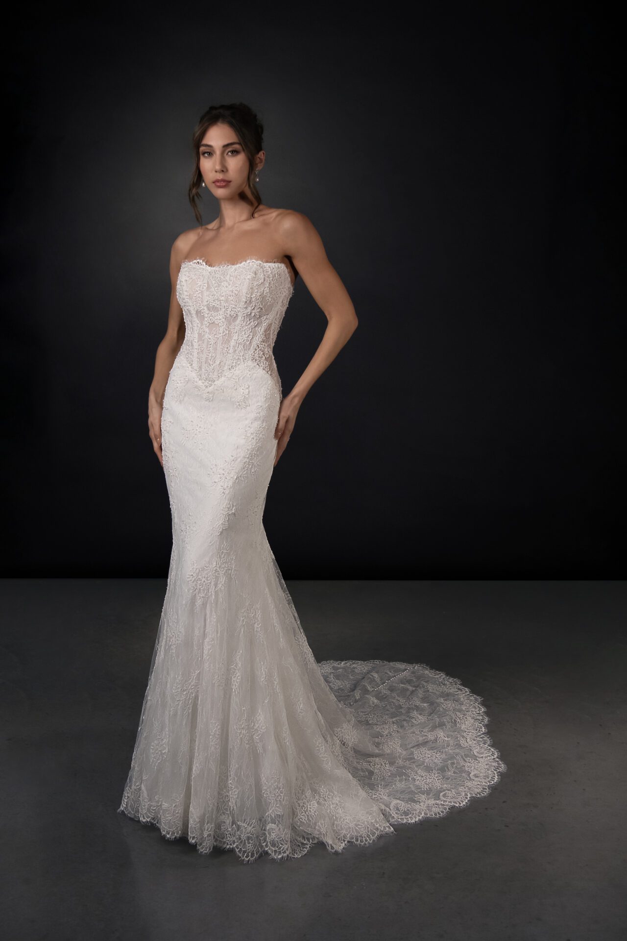 Martina Liana lace and tulle fit-and-flare wedding gown with detachable high-neck cape and pearl buttons
