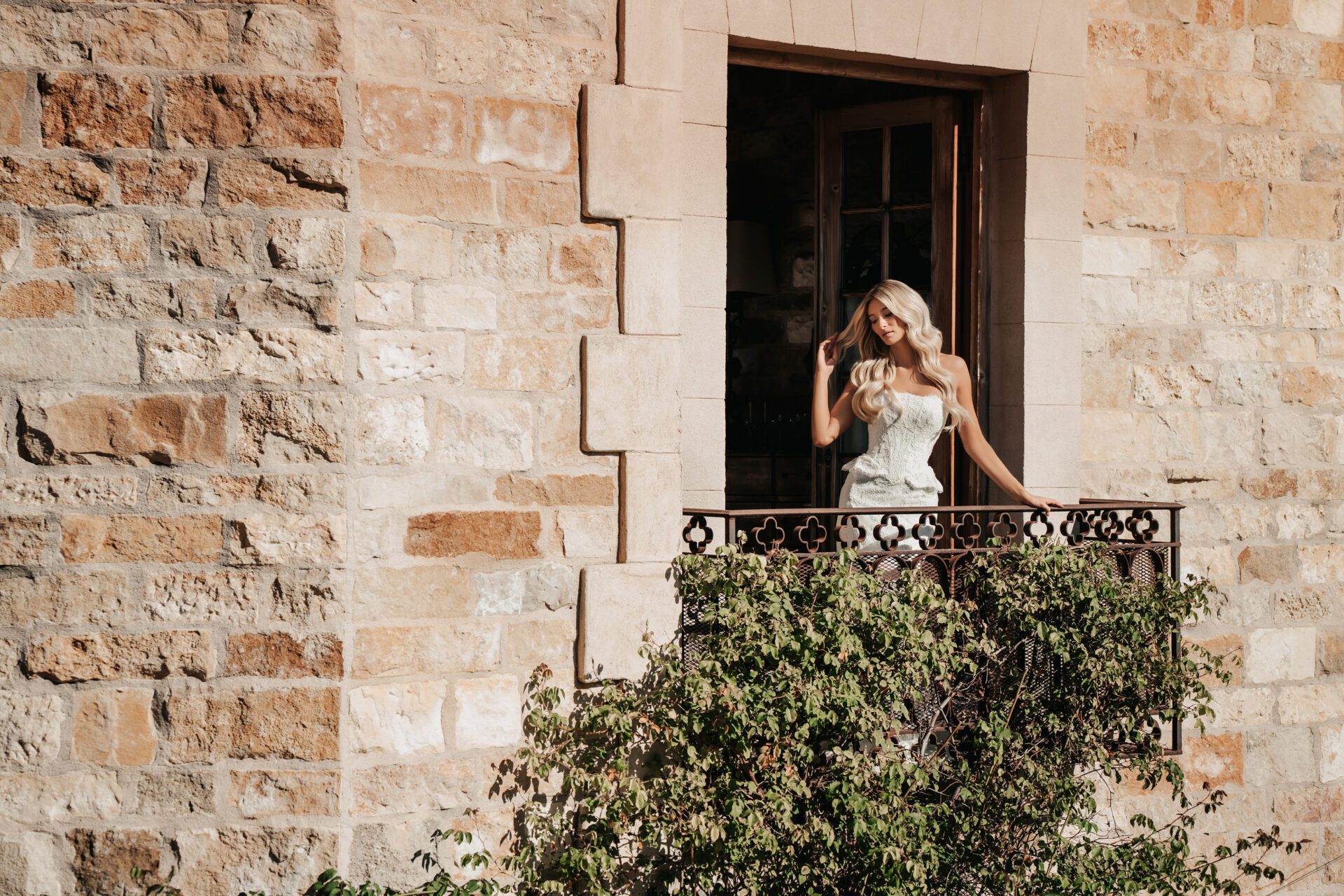 Martina Liana lace strapless fit-and-flare wedding gown with dainty peplum waist detail